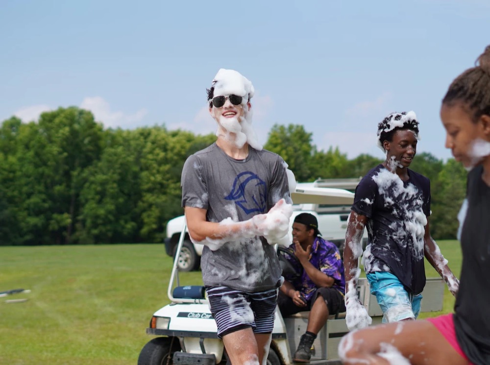campers at a foam party